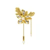 Vanda Limbata Lapel Pin with Citronella Leaves in Gold and Palladium